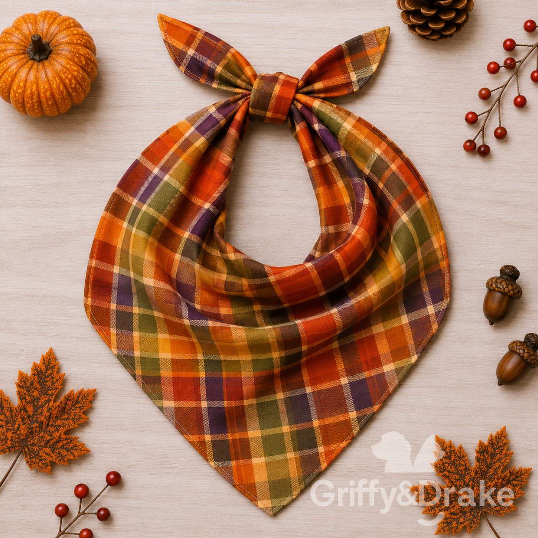 Autumn plaid pet bandana in orange, burgundy, olive green, and cream.
