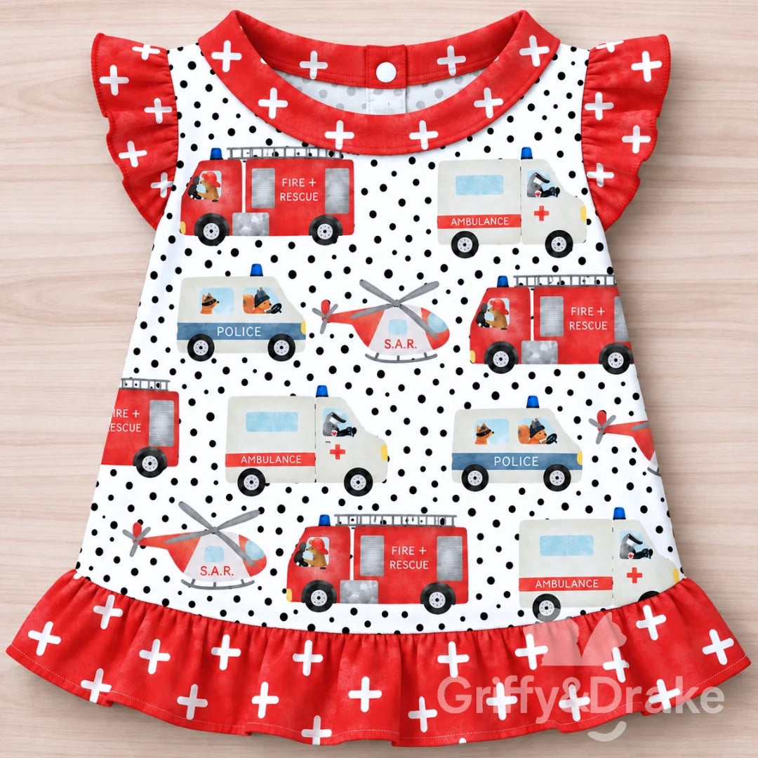 Ready to Rescue ruffle pet shirt with fire trucks, ambulances, police vehicles and rescue helicopters with red ruffle trim.