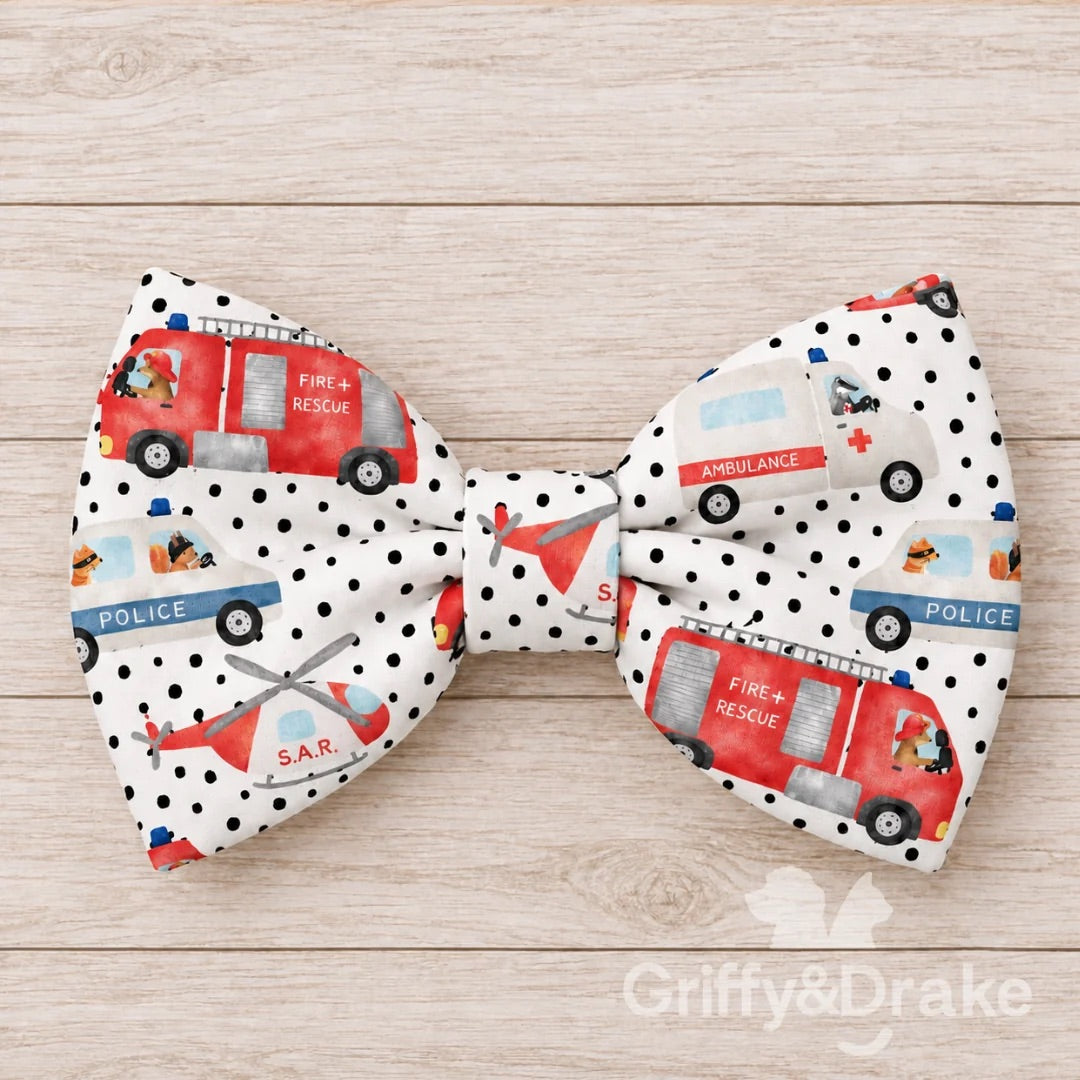 Ready to Rescue pet bow tie with colorful fire trucks, ambulances, police vehicles and rescue helicopters.