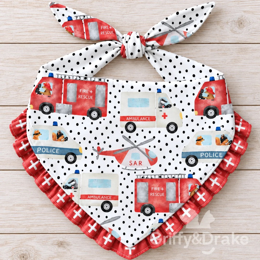 Ready to Rescue ruffle pet bandana featuring fire trucks, ambulances, police vehicles and rescue helicopters with red ruffle trim.