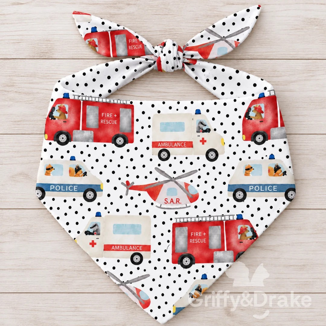 Ready to Rescue pet bandana featuring fire trucks, ambulances, police vehicles and rescue helicopters on a white dotted background.