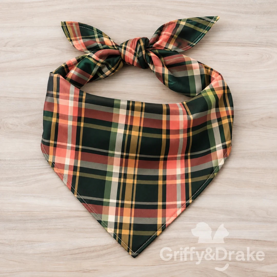 Wildflower Wishes pet bandana in deep green, coral, cream, and golden yellow plaid.