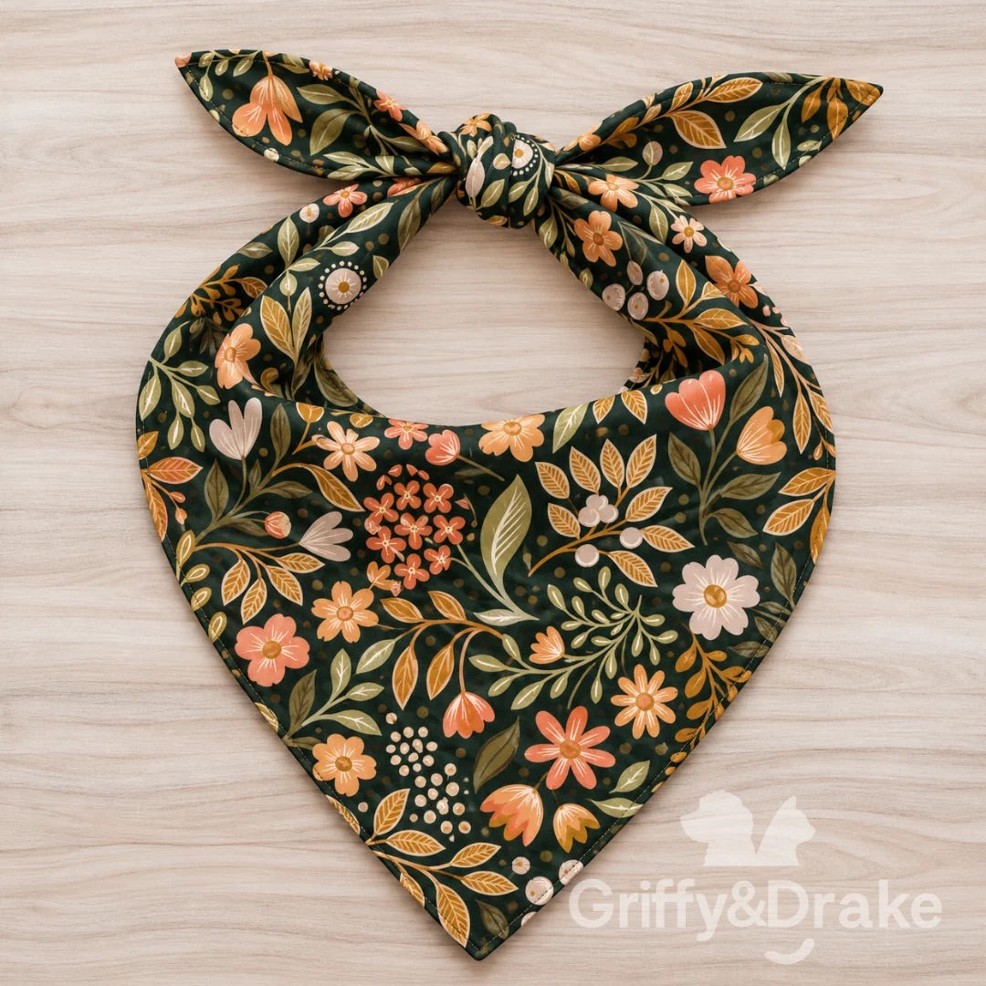 Wildflower Wishes pet bandana with peach, coral, and cream flowers and green leaves on a dark background.