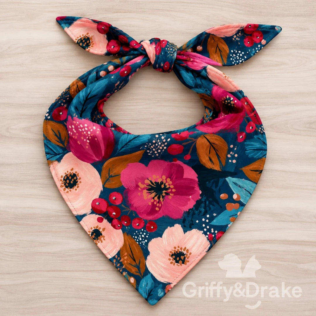 Cranberry Kisses pet bandana with cranberry, pink, and peach flowers and teal leaves on a deep blue background.